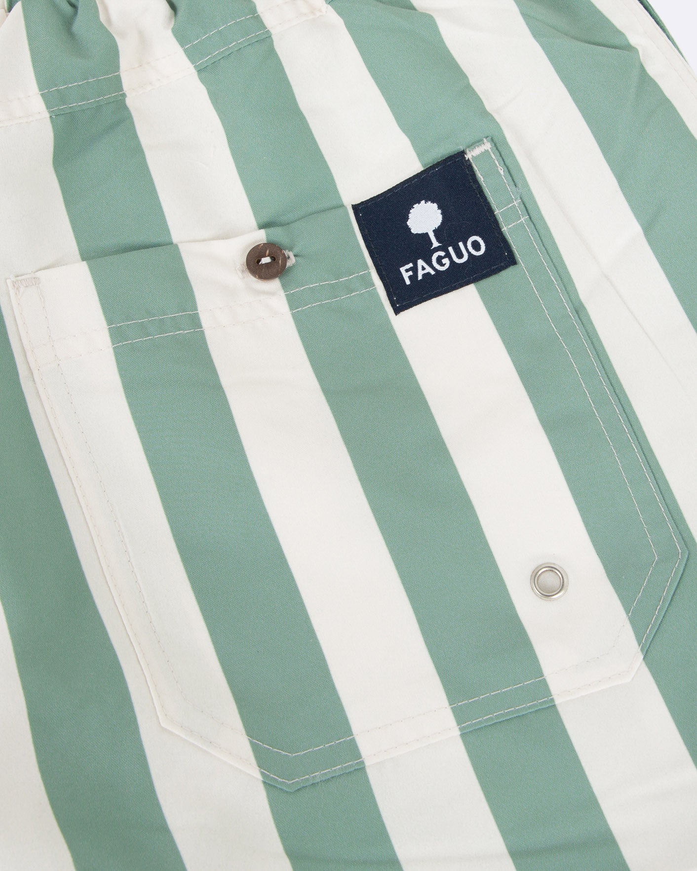 Ecru swim trunks with green stripes