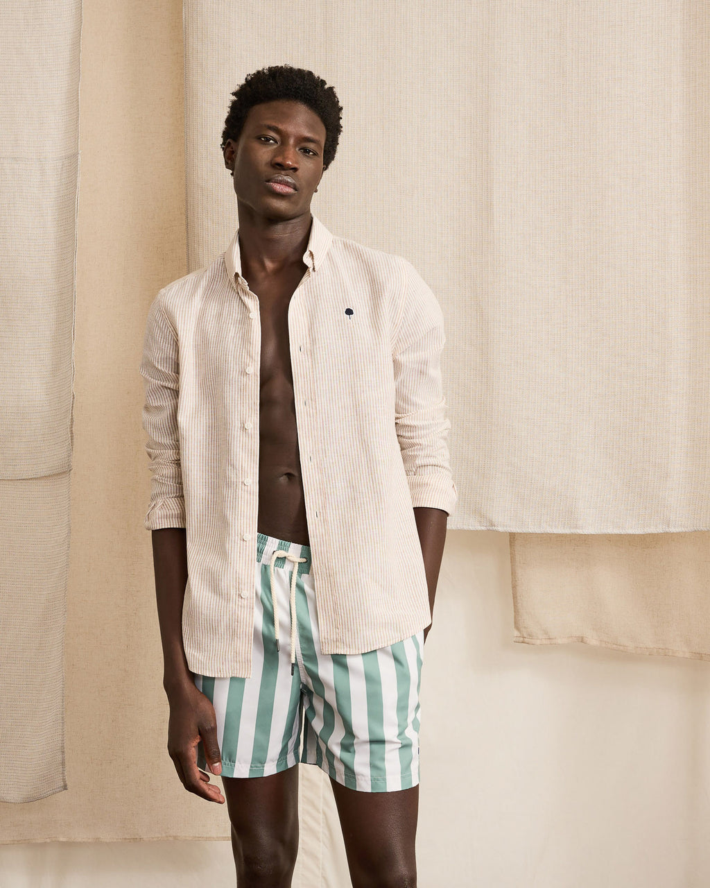 Ecru swim trunks with green stripes