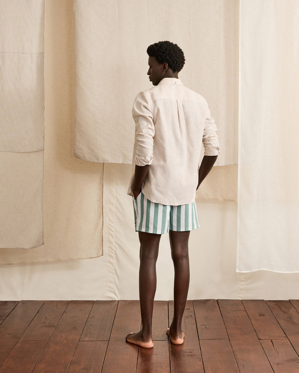 Ecru swim trunks with green stripes