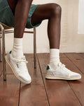 White & green low-top trainers