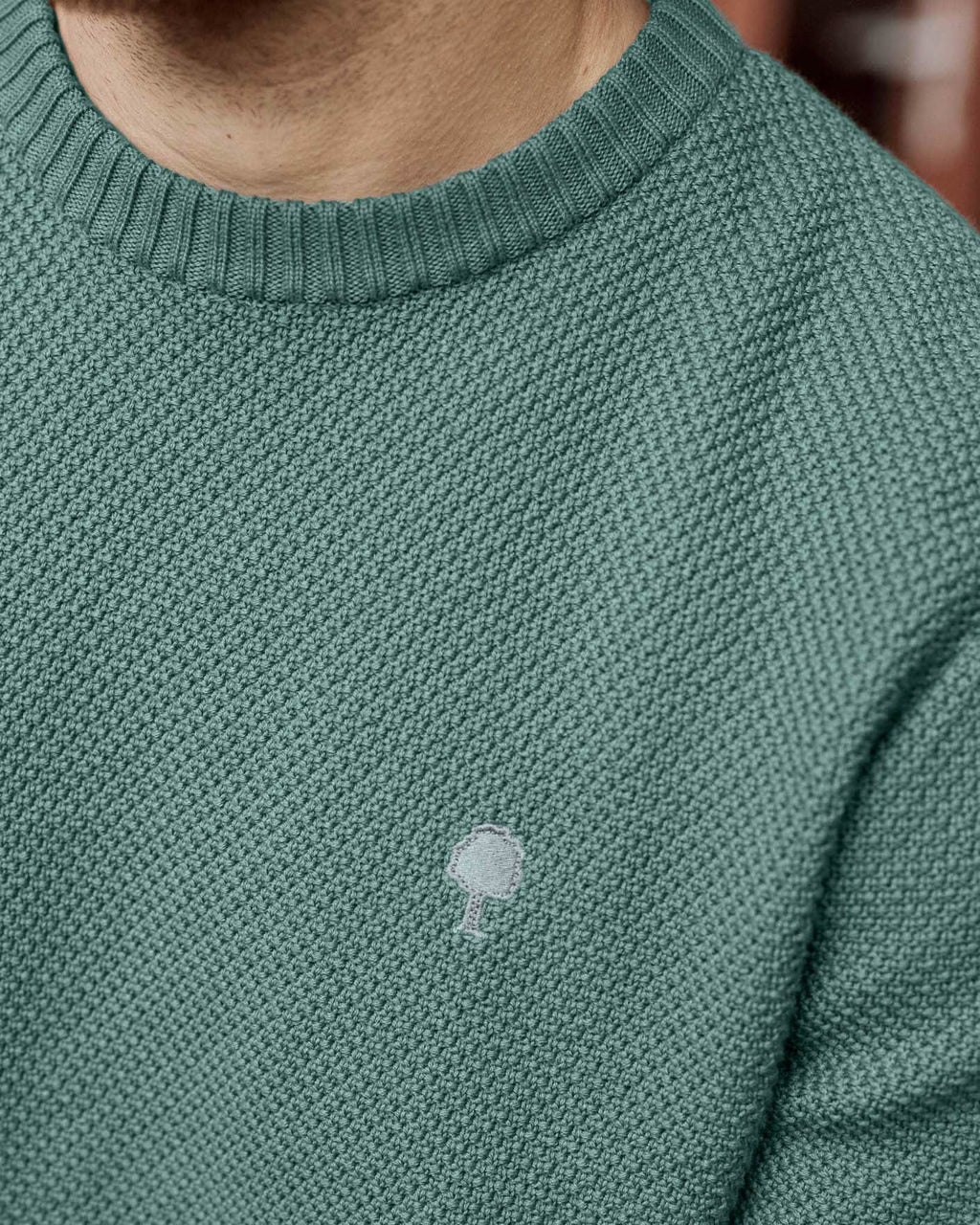 Water green jumper with tree embroidery
