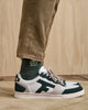 Baskets blanches & vert foncé