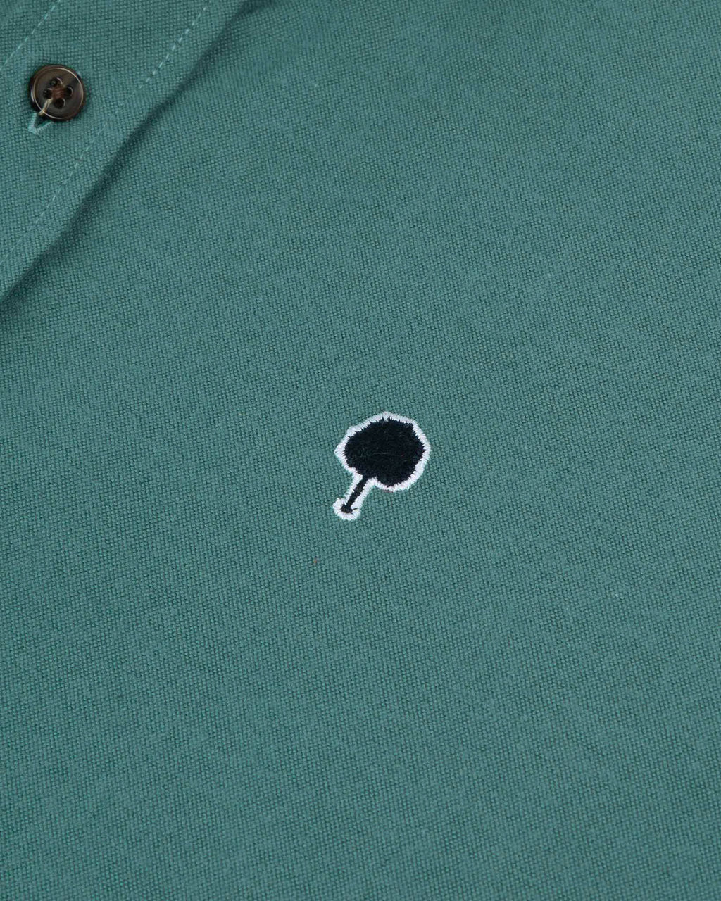 Light green shirt tree embroidery